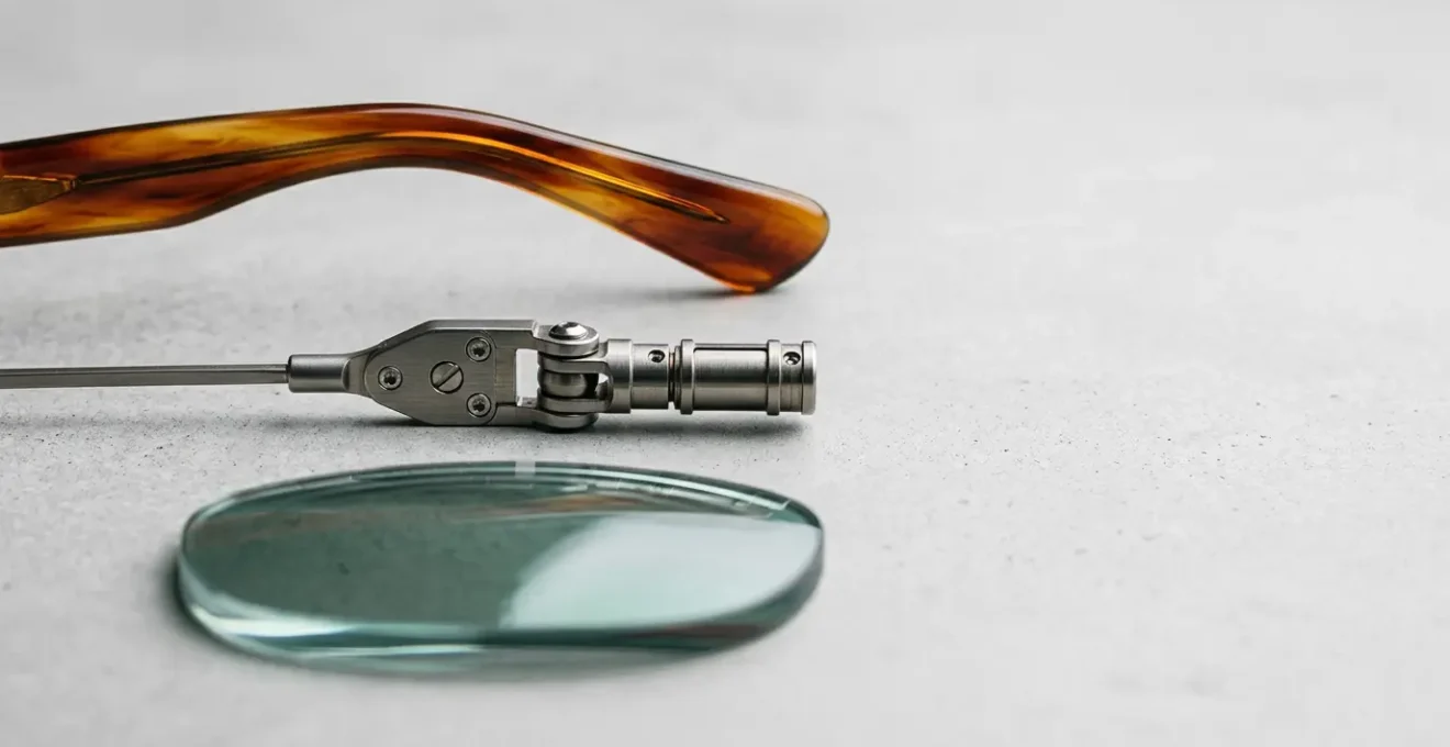 A detailed close-up view of premium eyewear components showcasing the intersection of designer craftsmanship and optical technology