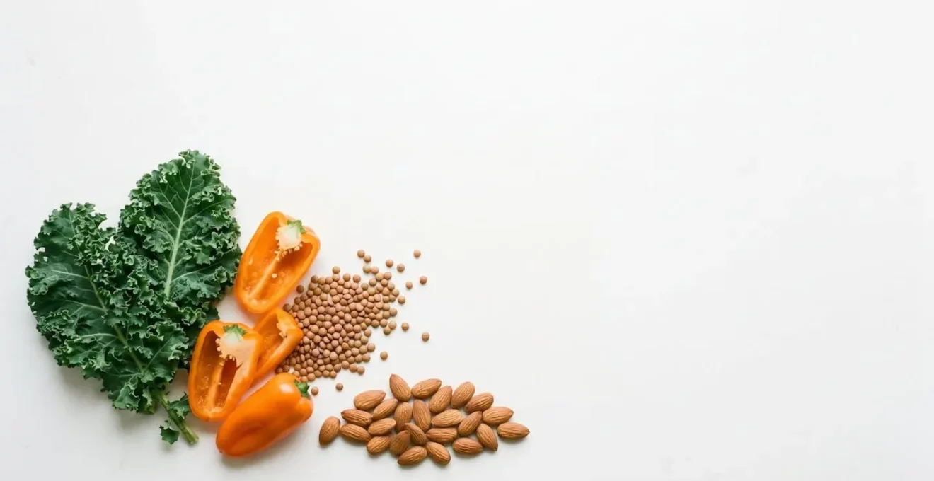 Scientific still life of natural whole foods representing AREDS2 formula components arranged with clean minimalist composition