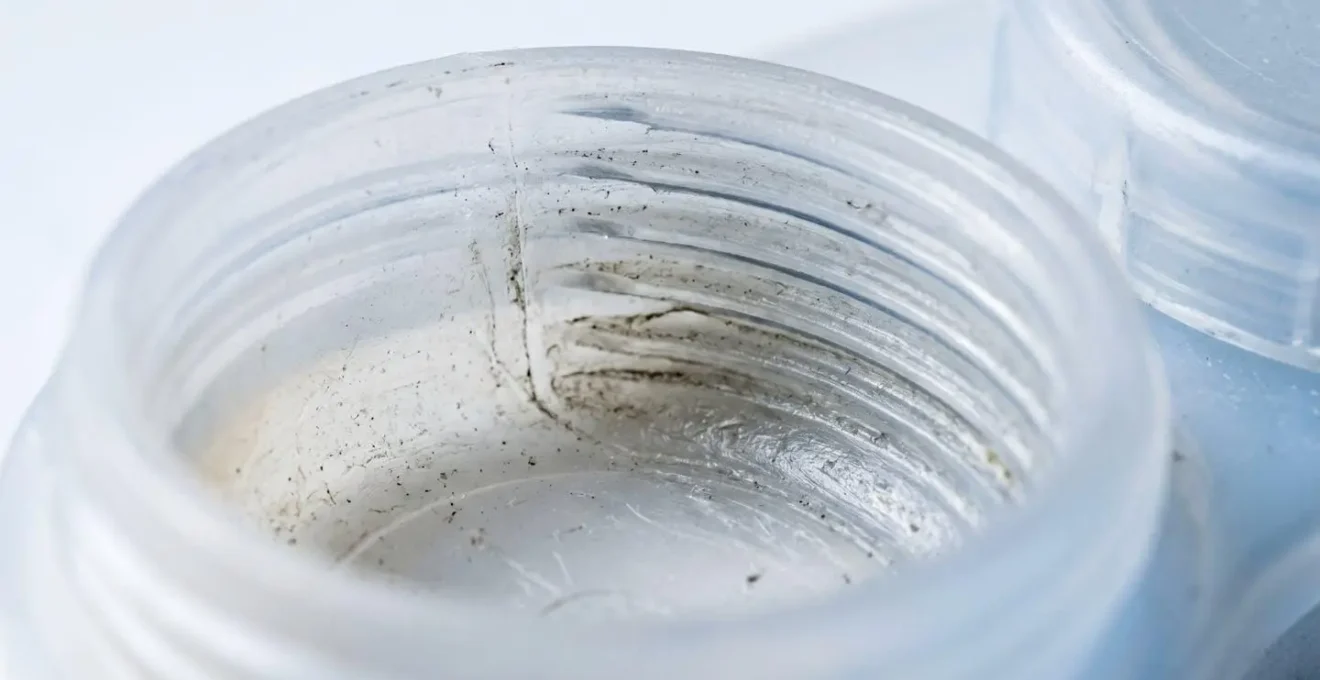 Macro view showing bacterial biofilm formation in contact lens case