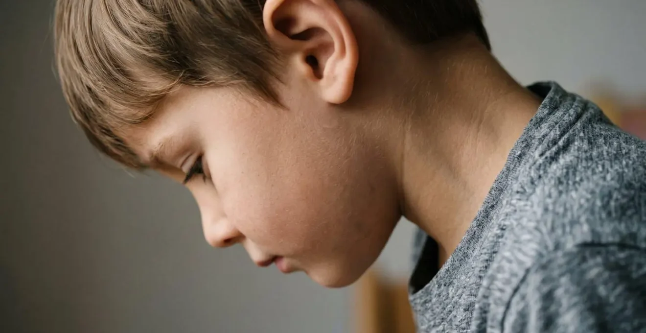 Close-up view of child's natural head tilt while focusing on near work task