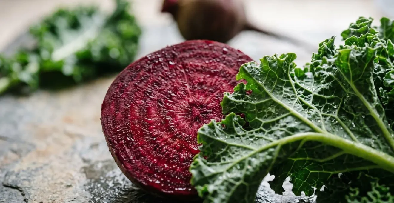 Extreme close-up macro photograph of fresh beetroot and kale showing rich textures and natural color depth