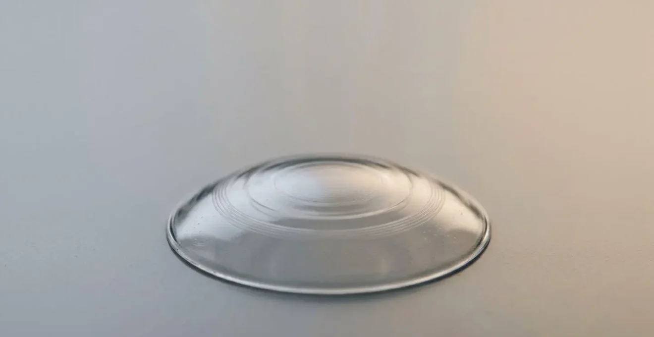 Macro detailed view of specialized orthokeratology lens showcasing precision optical engineering