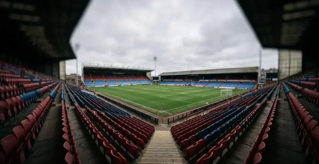 Wide-angle view of empty football stadium seats with darkened edges illustrating gradual peripheral vision narrowing