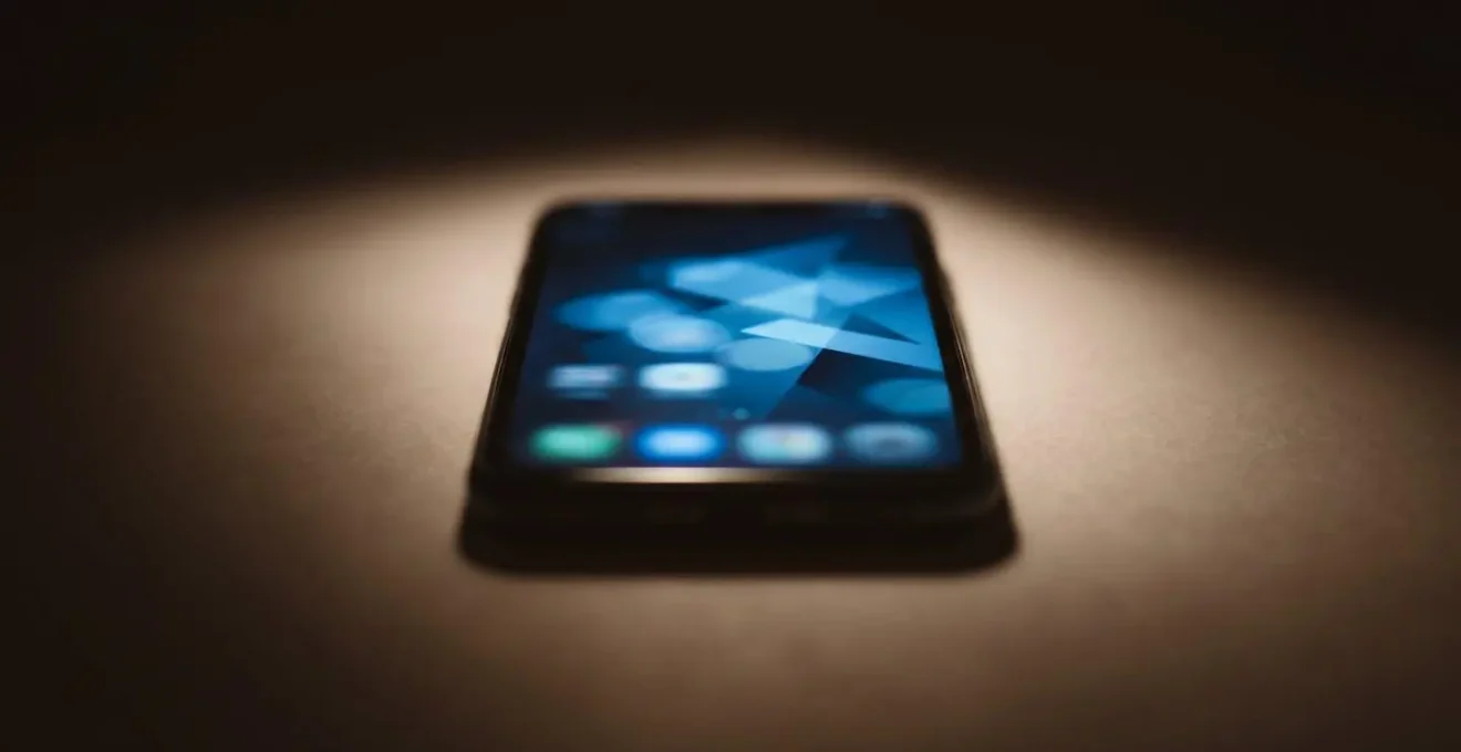 Abstract representation of smartphone displaying eye test pattern with blurred unfocused elements showing limitations of digital screening